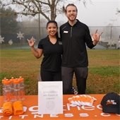 Picture of people standing behind a table 