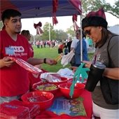 HEB Employee giving out promotional items